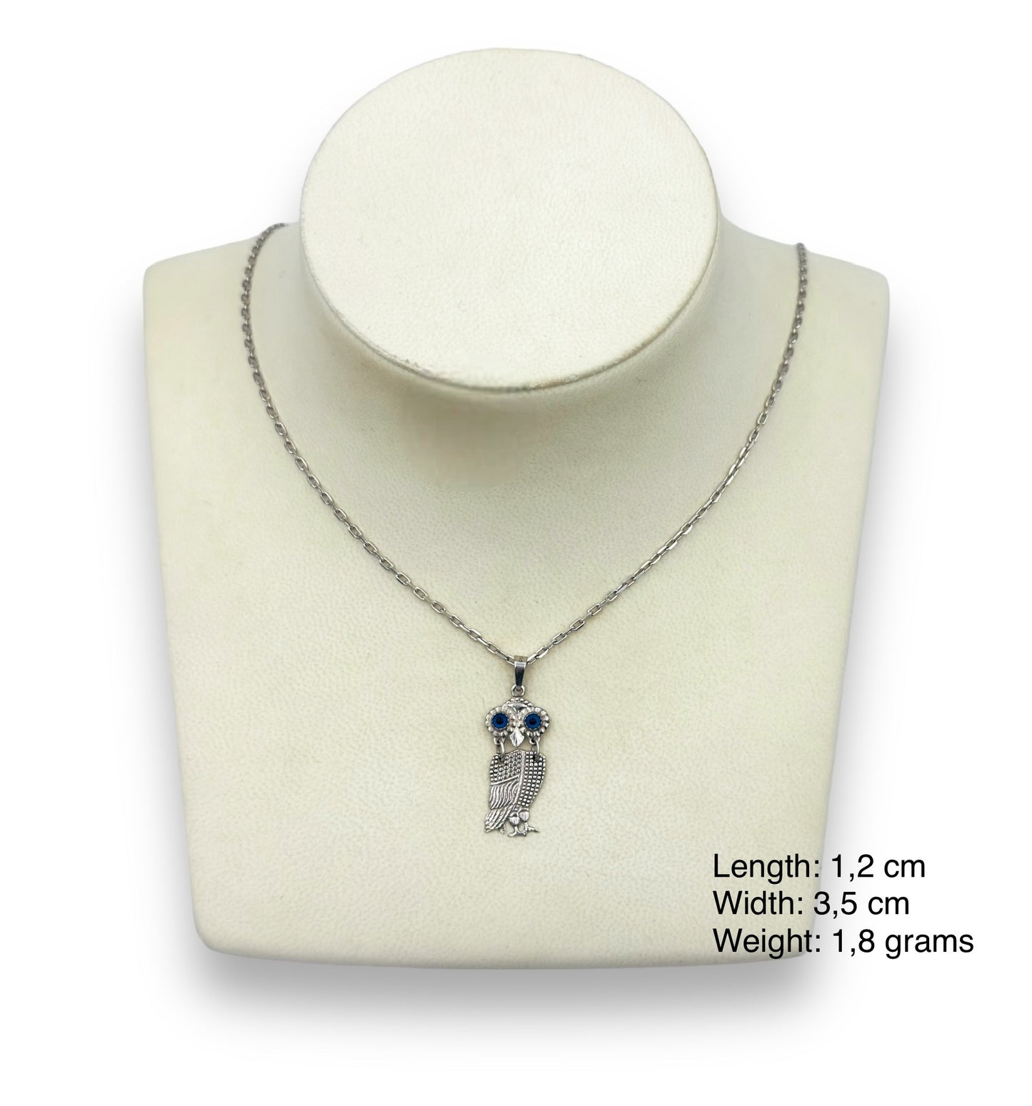 Silver Owl design pendant with synthetic stones