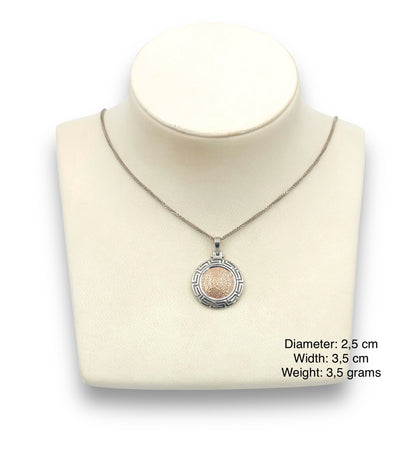 Silver two-toned Disc of Phaistos pendant enclosed with Meander design